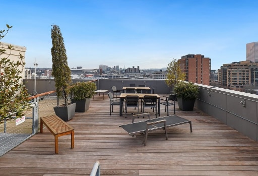Rooftop deck with city views and outdoor seating